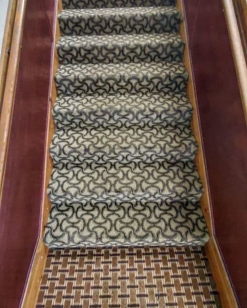 J&K Precision technician steam-cleaning a residential carpet